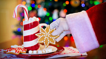 Image of Santa's hand reaching out to grab Christmas coffee